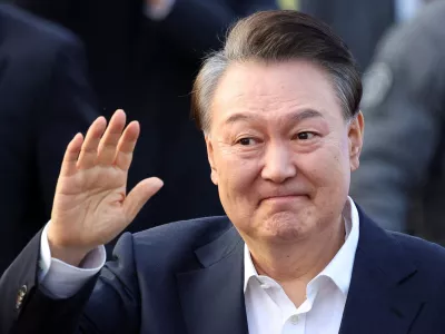 FILE PHOTO: South Korean impeached President Yoon Suk Yeol reacts outside the Seoul detention center after his release, in Uiwang, South Korea, March 8, 2025. REUTERS/Kim Hong-ji/File Photo