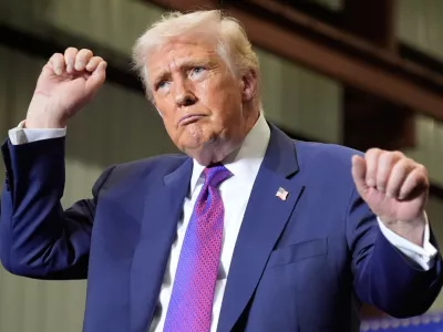 President Donald Trump dances after speaking at Coosa Steel Corporation in Rome, Ga., Thursday, Feb. 19, 2026. (AP Photo/Mark Schiefelbein)