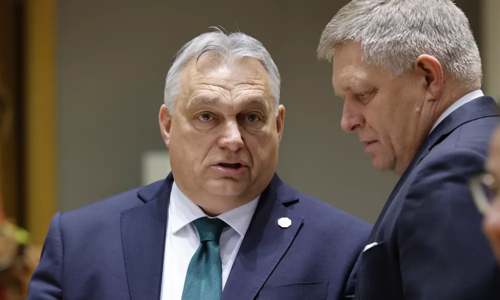 Slovakia's Prime Minister Robert Fico, right, talks to Hungary's Prime Minister Viktor Orban during a round table meeting at an EU summit in Brussels, Thursday, Feb. 1, 2024. European Union leaders meet in Brussels for a one day summit to discuss the revision of the Multiannual Financial Framework 2021-2027, including support for Ukraine. (AP Photo/Geert Vanden Wijngaert)
