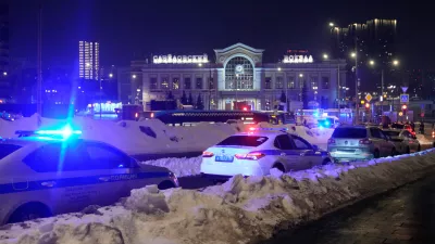 Police and emergency services are seen at the scene of an attack on a police patrol near the Savyolovsky Railway Station, in Moscow, Tuesday, Feb. 24, 2026. (AP Photo)