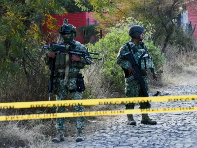 Soldiers stand at a cordoned‑off area where federal forces carried out an operation to capture cartel boss Nemesio Oseguera, 'El Mencho,' who died in a helicopter after being injured during a Mexican special‑forces raid in a wooded area outside the town Tapalpa, Mexico, February 23, 2026. REUTERS/Liberto Urena