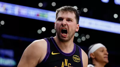 Los Angeles Lakers guard Luka Doncic (77) reacts after scoring during the second half of an NBA basketball game against the Orlando Magic, Tuesday, Feb. 24, 2026, in Los Angeles. (AP Photo/Caroline Brehman)