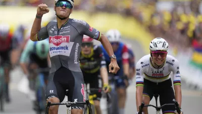 Netherlands' Mathieu van der Poel celebrates as he crosses the finish line to win the second stage of the Tour de France cycling race over 209.1 kilometers (129.9 miles) with start in Lauwin-Planque and finish in Boulogne-sur-Mer, France, Sunday, July 6, 2025. Slovenia's Tadej Pogacar finished second. (AP Photo/Mosa'ab Elshamy)