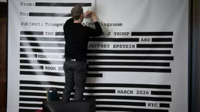 An "Epstein Reading Room" studio backdrop, of a redacted email, is set-up for guest photos during a rebuttal to President Donald Trump's State of the Union hosted by Defiance.org, the Portland Frog Brigade, and COURIER, at the National Press Club, in Washington, Tuesday, Feb. 24, 2026. (AP Photo/Cliff Owen)