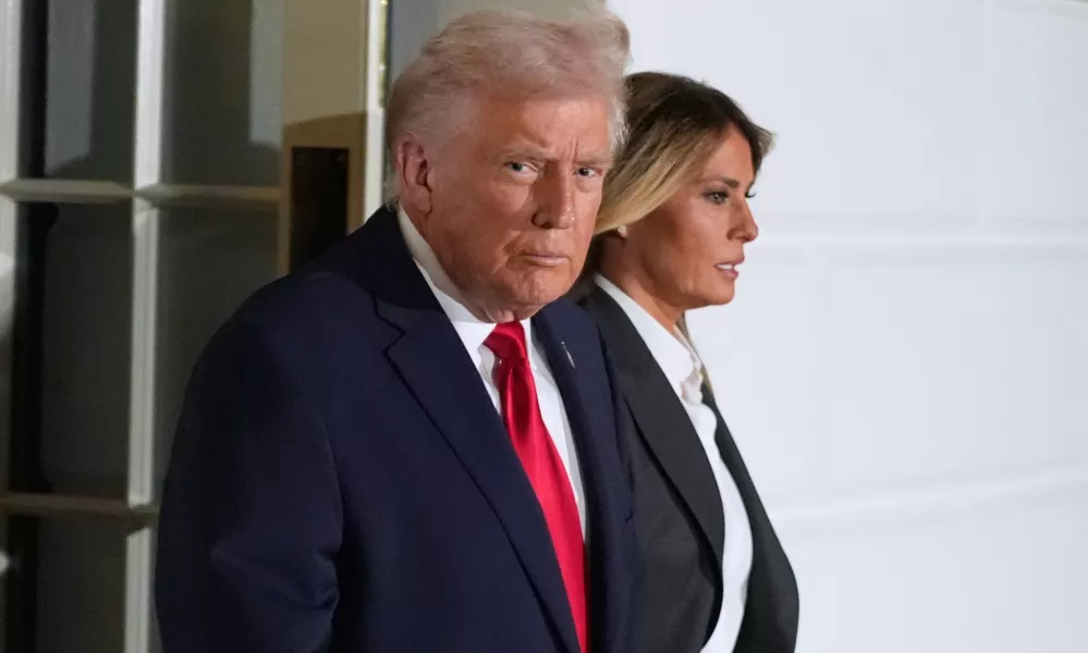 President Donald Trump and first lady Melania Trump, walk out of the White House, Tuesday, Feb. 24, 2026, to travel to the U.S. Capitol where he will deliver the State of the Union address to a joint session of Congress in the House chamber, in Washington. (AP Photo/Manuel Balce Ceneta)