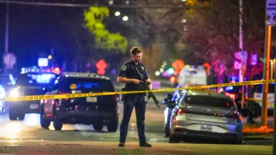 An Austin police officer guards the scene on West 6th Street at West Avenue after a shooting, Sunday March 1, 2026, in Austin, Texas. (Ricardo B. Brazziell/Austin American-Statesman via AP)