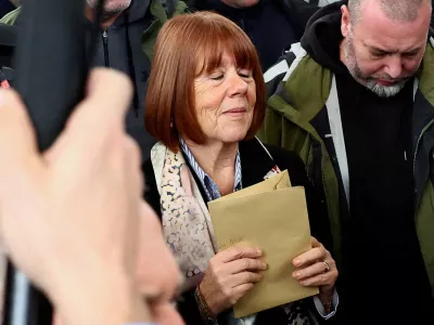FILE PHOTO: Frenchwoman Gisele Pelicot, the victim of a mass rape orchestrated by her then-husband Dominique Pelicot at their home in the southern French town of Mazan, reacts as she leaves after the verdict in the trial for Dominique Pelicot and 50 co-accused, at the courthouse in Avignon, France, December 19, 2024. REUTERS/Manon Cruz/File Photo