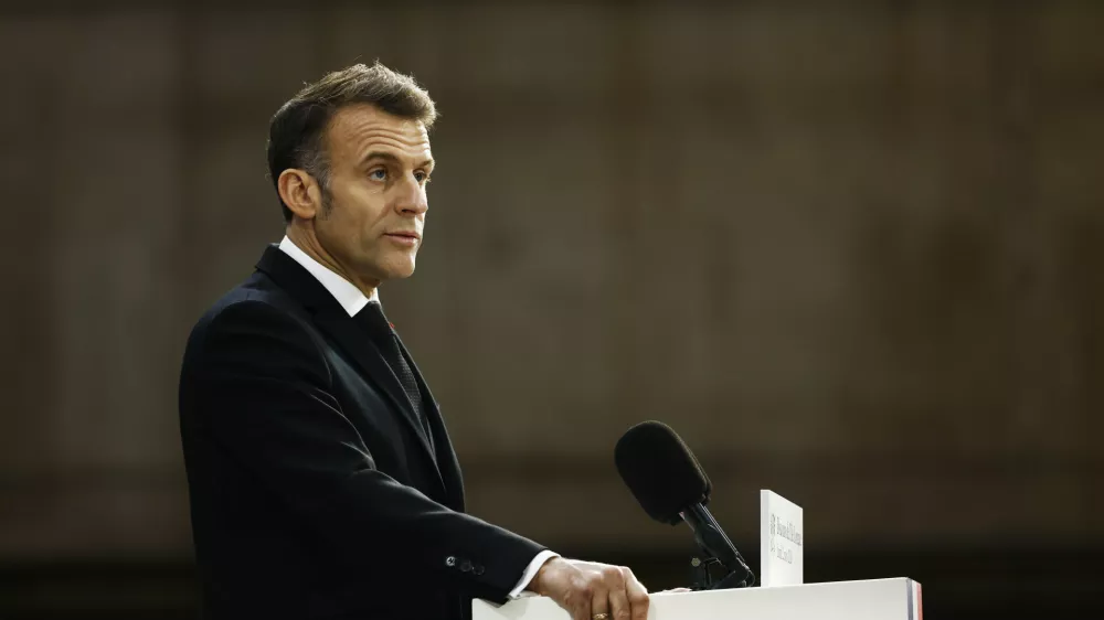 French President Emmanuel Macron delivers a speech next to the submarine 'Le Temeraire' (The Temerarious) at the Nuclear submarines Navy base of Ile Longue in Crozon, France, Monday March 2, 2026. (Yoan Valat/Pool Photo via AP)