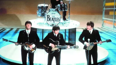 ** FILE **The Beatles perform on the CBS "Ed Sullivan Show" in New York, in this Feb. 9, 1964, file photo. From left, front, are Paul McCartney, George Harrison and John Lennon. Ringo Starr plays drums in the background. The Beatles' "Love" album is being released on Nov. 21, and is a thorough reinterpretation of their work. (AP Photo/FILE)------4 k