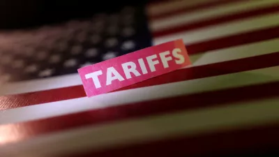 FILE PHOTO: A U.S. flag and a "tariffs" label are seen in this illustration taken April 10, 2025. REUTERS/Dado Ruvic/Illustration/File Photo