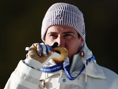 Milano Cortina 2026 Olympics - Biathlon - Men's 10km Sprint Victory Ceremony - Anterselva Biathlon Arena, South Tyrol, Italy - February 13, 2026. Gold medallists Quentin Fillon Maillet of France celebrates on the podium after winning Men's 10km Sprint REUTERS/Eloisa Lopez
