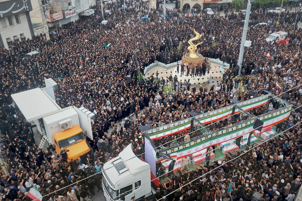Residents and officials attend the funeral of people killed in what Iranian officials said was an Israeli-U.S. strike Feb. 28 on a girls' elementary school in Minab, Iran, Tuesday, March 3, 2026. (Abbas Zakeri/Mehr News Agency via AP)