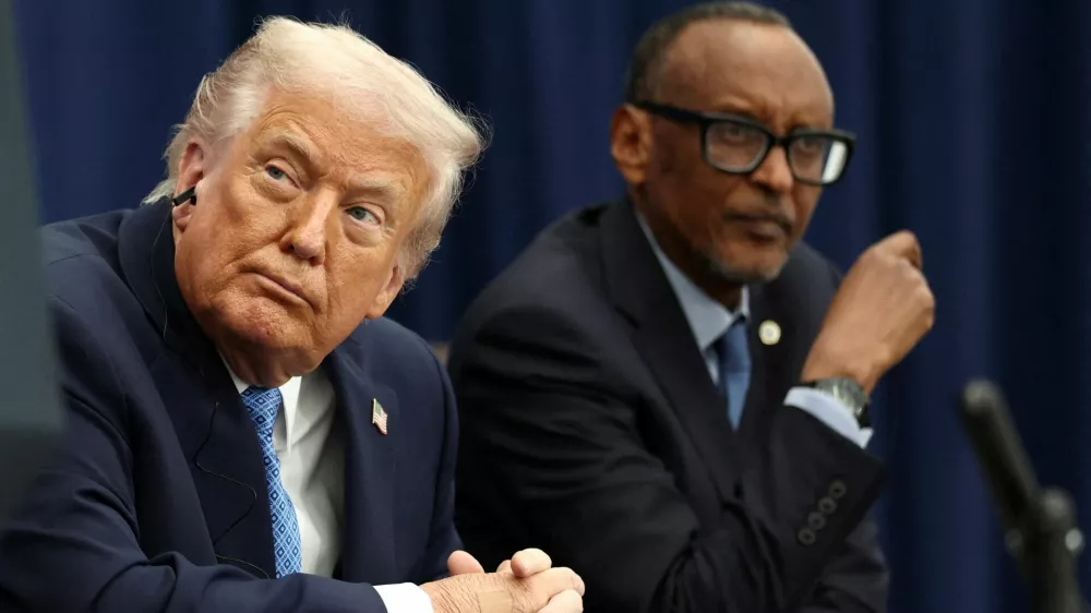 FILE PHOTO: U.S. President Donald Trump listens to President of the Democratic Republic of the Congo Felix Tshisekedi (not pictured) speak during a signing ceremony with President of Rwanda Paul Kagame at the U.S. Institute of Peace in Washington, D.C., U.S., December 4, 2025. REUTERS/Kevin Lamarque/File Photo
