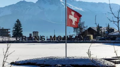 FILE PHOTO: A Swiss flag flutters at half-mast, after a deadly fire and explosion during a New Year's Eve party, in the upscale ski resort of Crans-Montana in southwestern Switzerland, January 7, 2026. REUTERS/Umit Bektas/File Photo