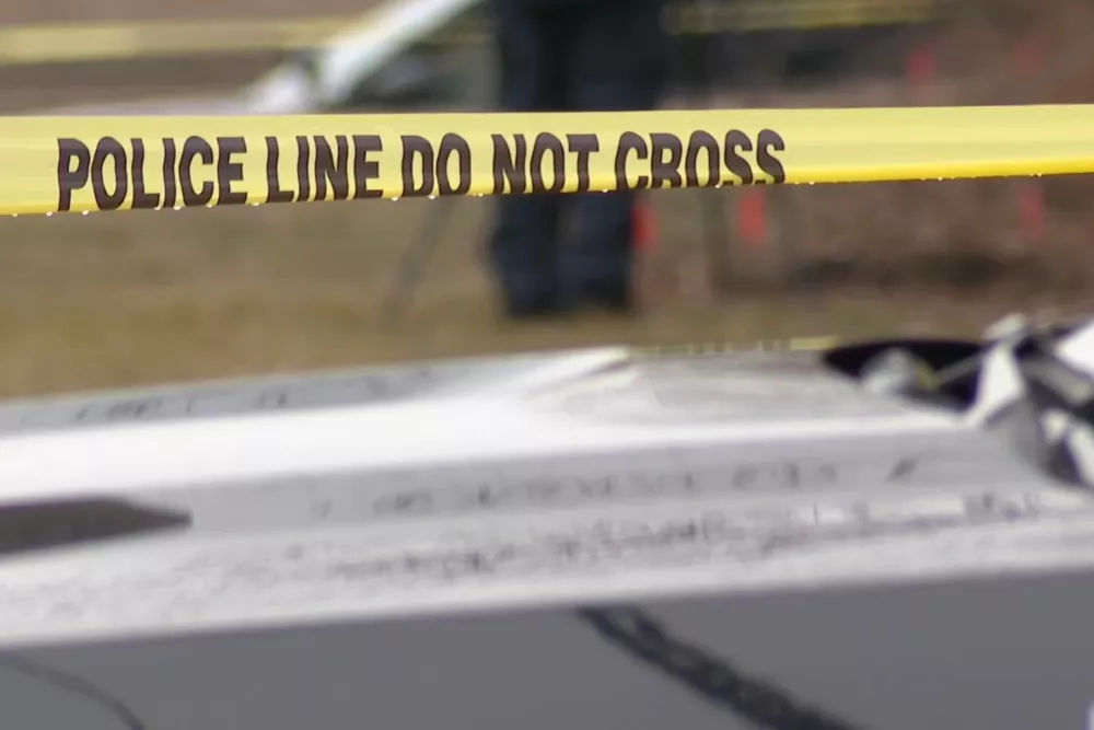 This image made from video provided by WEWS/News 5 shows caution tape at a crime scene where the bodies of two young girls were found buried in suitcases, Tuesday, March 3, 2026, in Cleveland. (WEWS/News 5 via AP)
