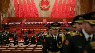 Military band members leave the venue following a rehearsal, before the opening session of the National People's Congress (NPC) at the Great Hall of the People in Beijing, China March 5, 2026. REUTERS/Florence Lo/Pool