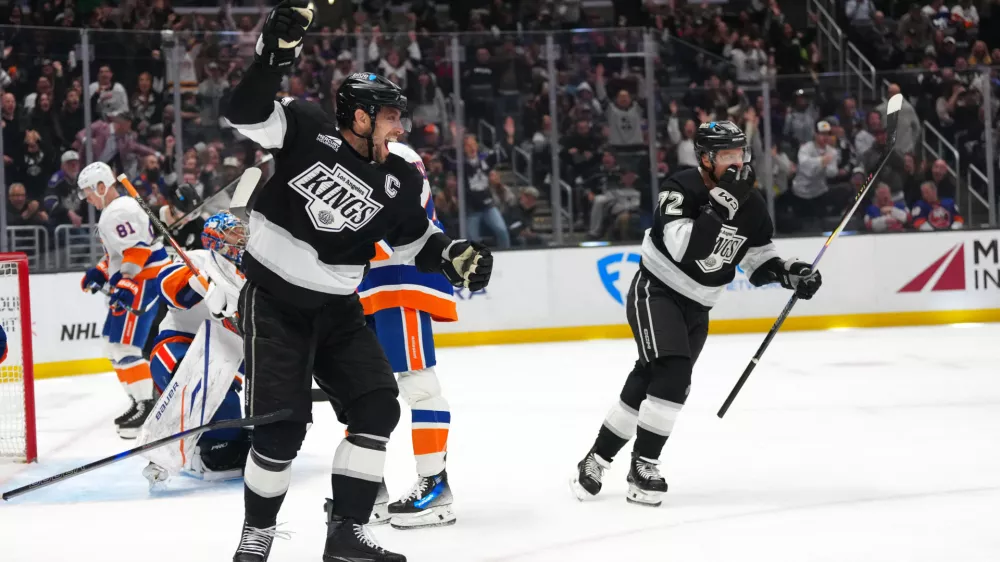 Mar 5, 2026; Los Angeles, California, USA; LA Kings center Anze Kopitar (11) and left wing Artemi Panarin (72) celebrate after a goal against the New York Islanders in the second period at Crypto.com Arena. Mandatory Credit: Kirby Lee-Imagn Images
