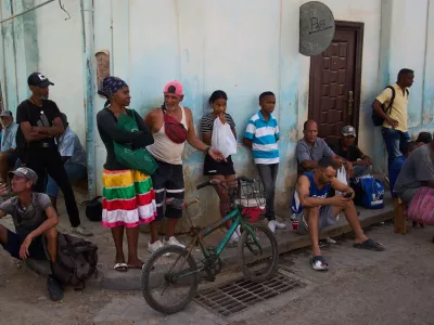 People wait their turn to buy bread during a blackout in Havana, Cuba, Thursday, March 5, 2026. (AP Photo/Ramon Espinosa)
