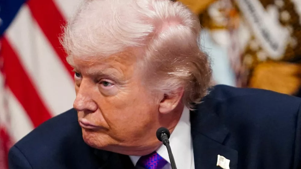 FILE PHOTO: U.S. President Donald Trump attends a roundtable on the Ratepayer Protection Pledge in the Indian Treaty Room in the Eisenhower Executive Office Building (EEOB) on the White House campus in Washington, D.C., U.S., March 4, 2026. REUTERS/Nathan Howard/File Photo