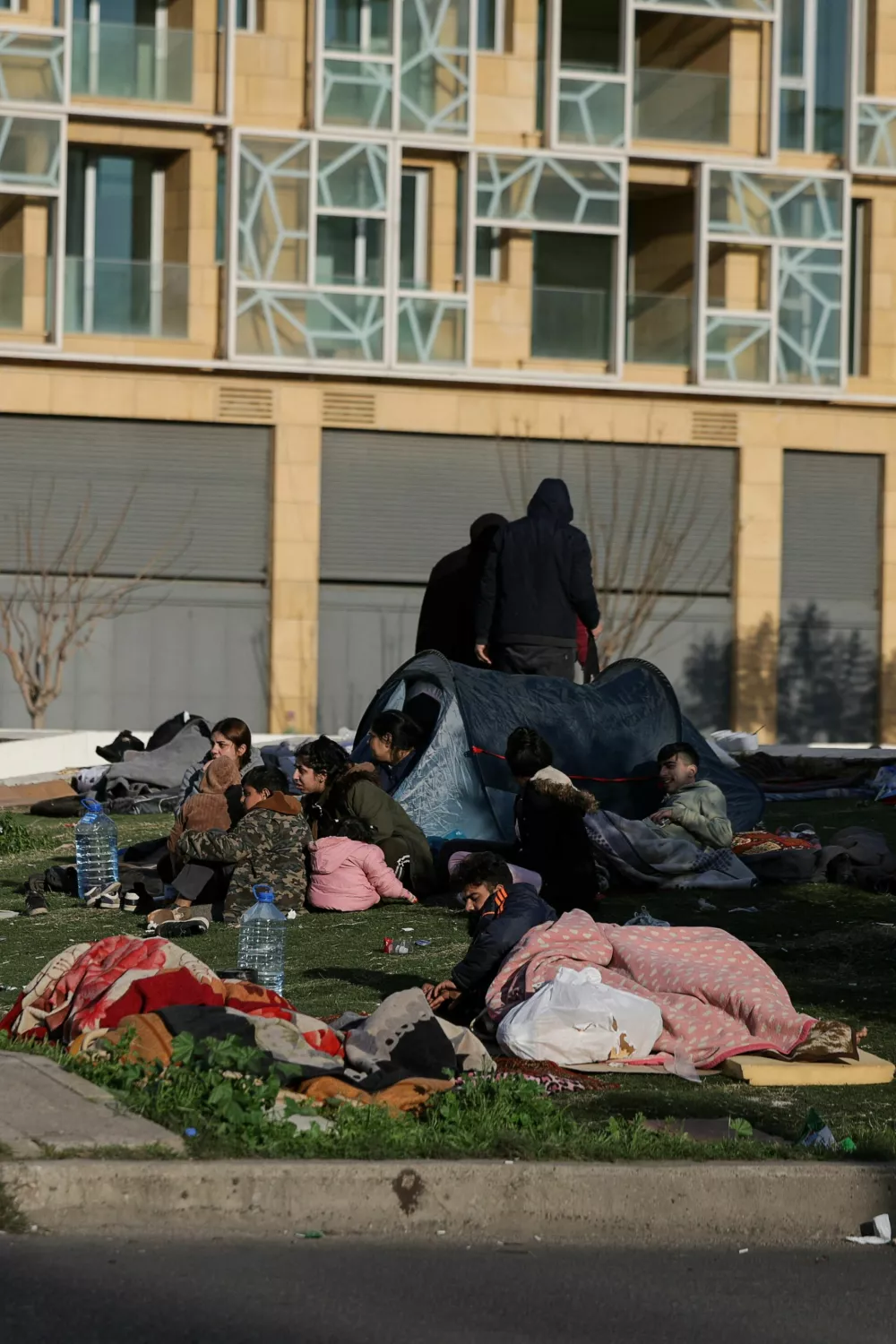 People displaced from the southern suburbs of Beirut after the Israeli army's warning prompted residents to evacuate, following an escalation between Hezbollah and Israel amid the U.S.-Israeli conflict with Iran, rest at Martyrs' Square in Beirut, Lebanon, March 6, 2026. REUTERS/Khalil Ashawi
