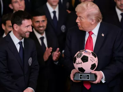 U.S. President Donald Trump is gifted a jewelled soccer ball with his signature on it from Inter Miami CF captain Lionel Messi, on the day he honors reigning Major League Soccer (MLS) champion Inter Miami CF players and team officials with an event in the East Room of the White House in Washington, D.C., U.S., March 5, 2026. REUTERS/Jonathan Ernst