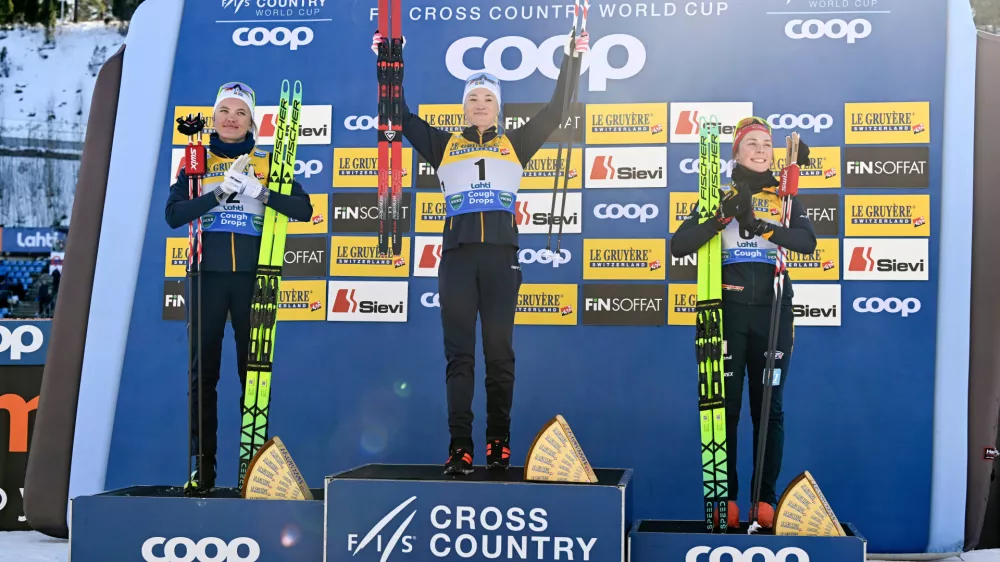 Winner Jonna Sundling of Sweden, center, second placed Linn Svahn of Sweden, left, and third placed Coletta Rydzek of Germany celebrate on the podium after the Cross-Country Skiing women's Sprint Free Style final at the FIS Nordic World Cup Lahti Ski Games in Lahti, Finland, Saturday March 7, 2026. (Emmi Korhonen/Lehtikuva via AP)