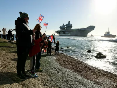 People gather to watch HMS Prince of Wales return home to Portsmouth, following an eight-month Indo-Pacific deployment as part of Operation Highmast, in Portsmouth, Britain November 30, 2025. UK MOD Crown/Ollie Leach/Handout via REUTERS THIS IMAGE HAS BEEN SUPPLIED BY A THIRD PARTY