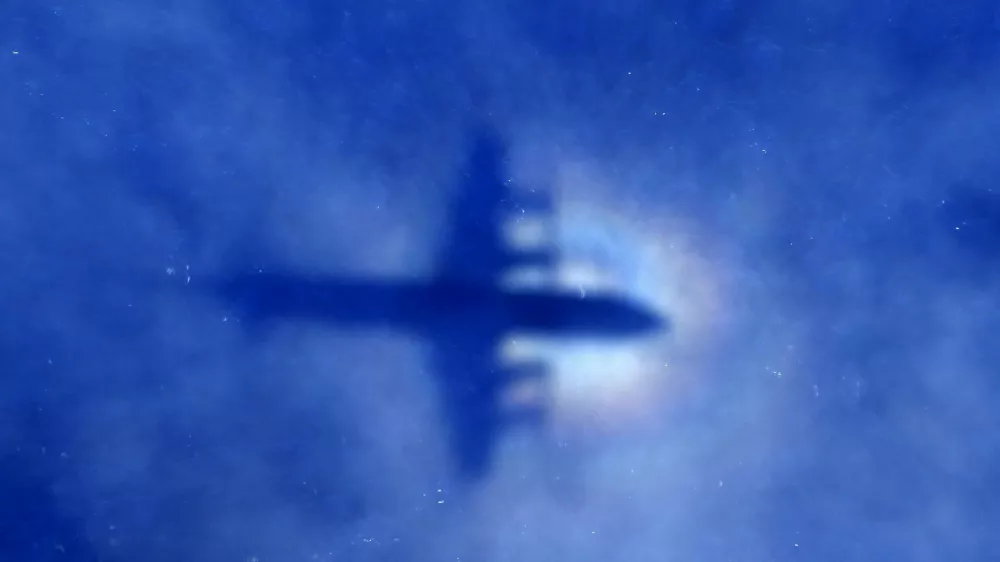 The shadow of a Royal New Zealand Air Force (RNZAF) P3 Orion maritime search aircraft can be seen on low-level clouds as it flies over the southern Indian Ocean looking for missing Malaysian Airlines flight MH370 in this March 31, 2014 file photo. Malaysia is "almost certain" that plane debris found on Reunion Island in the Indian Ocean is from a Boeing 777, the deputy transport minister said on July 30, 2015, heightening the possibility it could be wreckage from missing Flight MH370. REUTERS/Rob Griffith/Pool/Files