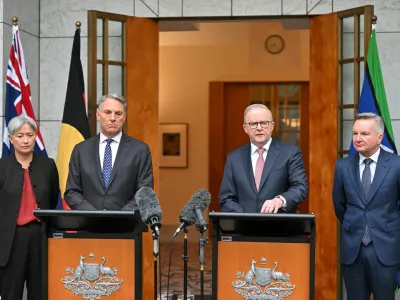Australia's Minister for Foreign Affairs Penny Wong, Deputy Prime Minister , PriRichard Marlesme Minister Anthony Albanese and Minister for Climate Change Chris Bowen attend a press conference at Parliament House in Canberra, Australia, March 10, 2026. AAP Image/Mick Tsikas/via REUTERS  ATTENTION EDITORS - THIS IMAGE WAS PROVIDED BY A THIRD PARTY. NO RESALES. NO ARCHIVE. AUSTRALIA OUT. NEW ZEALAND OUT. NO COMMERCIAL OR EDITORIAL SALES IN NEW ZEALAND. NO COMMERCIAL OR EDITORIAL SALES IN AUSTRALIA.