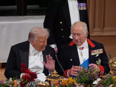 FILE PHOTO: US President Donald Trump and King Charles interact at the state banquet for the US President and First Lady Melania Trump at Windsor Castle, Berkshire, on day one of their second state visit to the UK, Wednesday September 17, 2025.  Yui Mok/Pool via REUTERS/File Photo