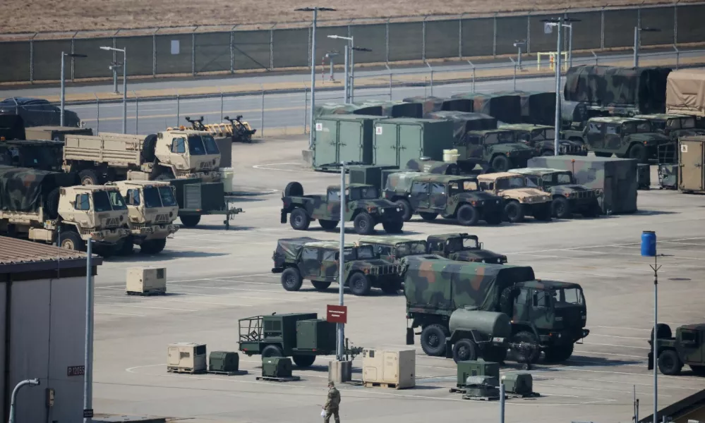 A U.S. army soldier walks past military vehicles at a U.S army base in Pyeongtaek, South Korea, March 10, 2026.  REUTERS/Kim Hong-Ji