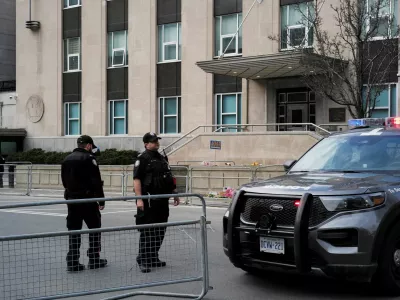 Members of the police stand guard ahead of a briefing by Deputy Chief Frank Barredo (TPS) and Chief Superintendent Chris Leather, Officer in Charge of Criminal Operations for RCMP Ontario, held at 360 University Avenue, providing an update regarding the firearm discharge that occurred at the U.S. Consulate, in Toronto, Ontario, Canada March 10, 2026. REUTERS/Wa Lone