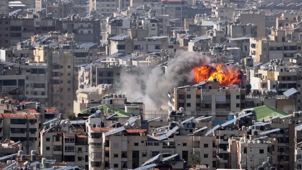Smoke and flames rise from an Israeli airstrike in Dahiyeh, Beirut's southern suburbs, Wednesday, March 11, 2026. (AP Photo/Hassan Ammar)