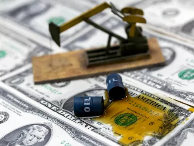 FILE PHOTO: Oil, miniatures of oil barrels, oil pump jack and U.S. dollar banknote are seen in this illustration taken, June 6, 2023. REUTERS/Dado Ruvic/Illustration/File Photo