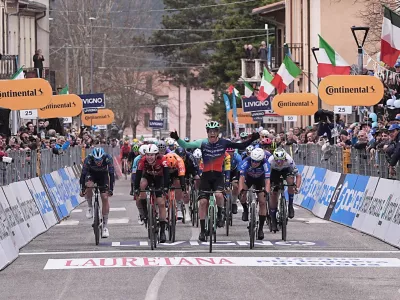 Denmark's Tobias Lund Andresen celebrates as he crosse the finish line to win the third stage of the Tirreno-Adriatico cycling race from Cortona to Magliano de' Marsi, Italy, Wednesday, March 11, 2026. (Marco Alpozzi/LaPresse via AP)