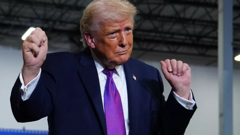 President Donald Trump dances after speaking at Verst Logistics Wednesday, March 11, 2026, in Hebron, Ky. (AP Photo/Julia Demaree Nikhinson)