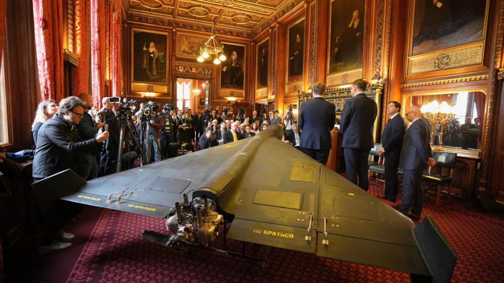 An Iranian Shahed-136 attack drone, acquired from Ukraine by United Against Nuclear Iran (UANI), is displayed at a press conference in Parliament in London, Tuesday, Oct. 14, 2025. (AP Photo/Kin Cheung)