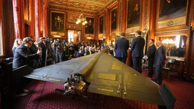 An Iranian Shahed-136 attack drone, acquired from Ukraine by United Against Nuclear Iran (UANI), is displayed at a press conference in Parliament in London, Tuesday, Oct. 14, 2025. (AP Photo/Kin Cheung)