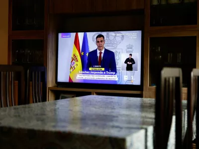 A TV screen shows a live broadcast of Spain's Prime Minister Pedro Sanchez, as he delivers an institutional statement to address the latest international developments, after U.S. President Donald Trump said on Tuesday that the U.S. would cut off all trade with Spain after the European country refused to let the U.S. military use its bases for missions linked to strikes on Iran, at a house in Ronda, Spain, March 4, 2026. REUTERS/Jon Nazca