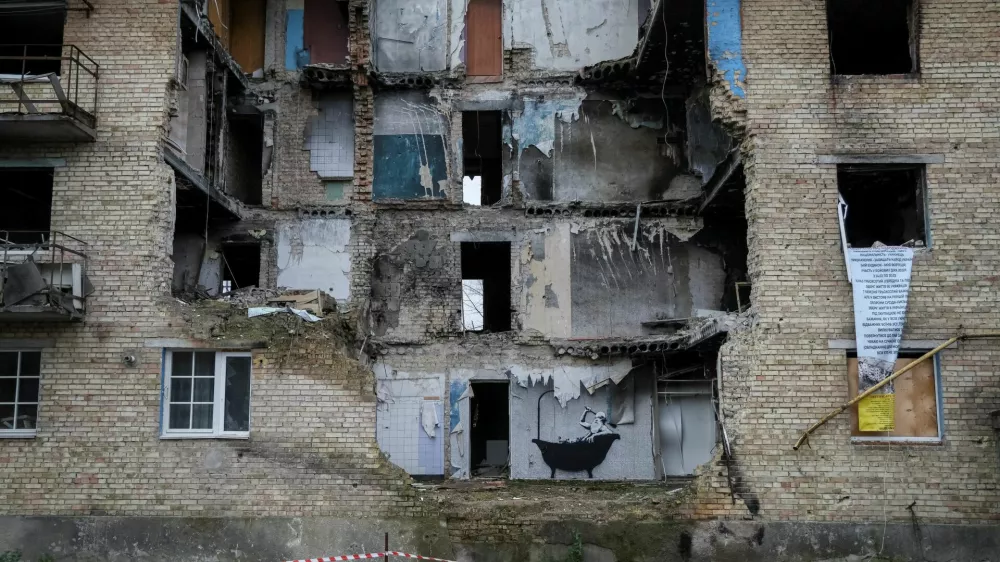 FILE PHOTO: A new graffiti in Banksy's signature style, although not posted by the mercurial artist on social media, is seen on the wall of a destroyed building in the Ukrainian village of Horenka, which had been occupied by Russia until April and heavily damaged by fighting in the early days of Russian invasion, November 13, 2022. REUTERS/Gleb Garanich