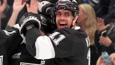 Los Angeles Kings defenseman Mikey Anderson, left, celebrates his goal with center Anze Kopitar during the second period of an NHL hockey game against the New York Islanders, Thursday, March 5, 2026, in Los Angeles. (AP Photo/Mark J. Terrill)