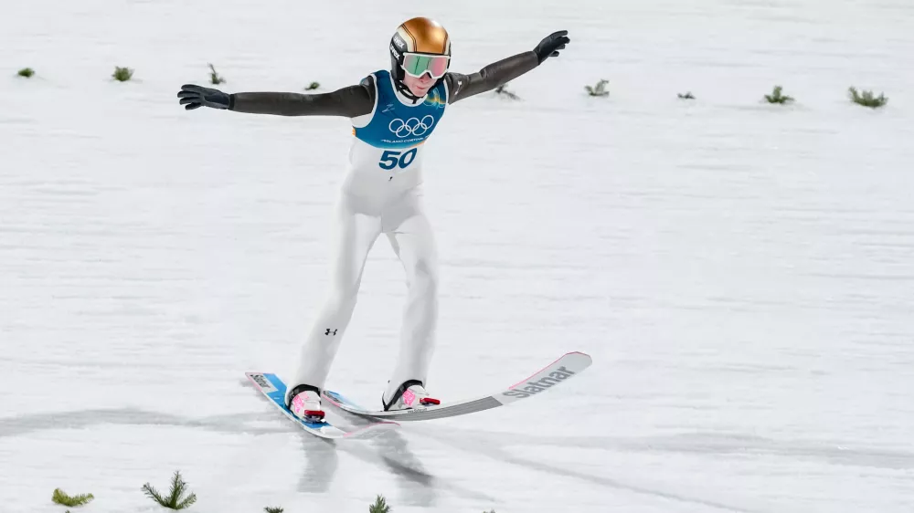 Nika Prevc, of Slovenia, lands her first round jump of the ski jumping women's large hill individual at the 2026 Winter Olympics, in Predazzo, Italy, Sunday, Feb. 15, 2026. (AP Photo/Kirsty Wigglesworth)