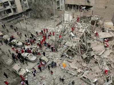 Emergency personnel work at the site of a strike on a residential building, amid the U.S.-Israeli conflict with Iran, in Tehran, Iran, March 16, 2026. Majid Asgaripour/WANA (West Asia News Agency) via REUTERS ATTENTION EDITORS - THIS PICTURE WAS PROVIDED BY A THIRD PARTY   TPX IMAGES OF THE DAY