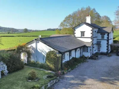 Story from Jam Press (Royal Station Sale)Pictured: The historic former railway station.Historic former railway station with link to secret romance goes on sale for just over Ł800,000A historic former railway station with a link to a secret royal romance has gone on the market for just over Ł800,000.The old Eyarth Station has been transformed into a plush country home while still keeping many of its original railway features.The station first opened in 1864 and was once a regular stop along the line.Passenger services on the route ended in 1953 and the last goods train ran in 1962, when Eyarth Station finally closed.Today the ticket office and station platform can still be seen, and the original station well, which once supplied water for the station master, has survived.The unique property sits in Llanfair Dyffryn Clwyd, near Ruthin in North Wales.It is also said to have played a part in a secret royal romance.Locals believe the former Prince of Wales, who later became King Edward VII, used the quiet station while having an affair with a local aristocrat.He is said to have stepped off the train at Eyarth rather than the busier Ruthin station to avoid being spotted.The property now boasts six bedrooms, seven bathrooms and five reception rooms.It was successfully run as a guest house for decades, as reported by Luxury Property News.Estate agents say the elegant country house offers spacious and versatile accommodation in an area famed for its natural beauty.The home is set in secluded gardens with patios and a pond.It also includes extensive parking, a paddock with stables, an established kitchen garden and two large paddocks.The grounds enjoy far-reaching views west across wooded countryside.Inside, the building still keeps key reminders of its railway past.These include part of the original platform, the old ticket office and even the station well, all carefully preserved within the property.The home is being marketed by estate agents Cavendish with a guide price of Ł820,000.ENDS,Image: 1081655754, License: Rights-managed, Restrictions:, Model Release: no