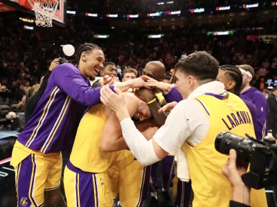 Mar 19, 2026; Miami, Florida, USA; Los Angeles Lakers team celebrates Luka Doncic (77) after 60 point game against the Miami Heat at Kaseya Center. Mandatory Credit: Isabella Frias-Imagn Images