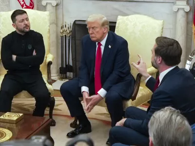 FILE - Vice President JD Vance, right, speaks with Ukrainian President Volodymyr Zelenskyy, left, as President Donald Trump listens in the Oval Office at the White House, Feb. 28, 2025, in Washington. (AP Photo/ Mystyslav Chernov, File)