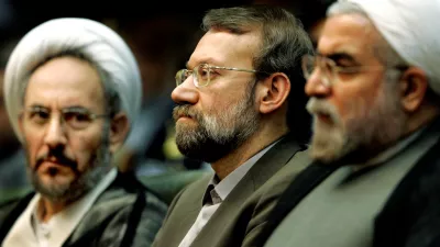 FILE PHOTO: Iran's former Intelligence Minister Ali Younesi (L), chief nuclear negotiator Ali Larijani and former chief nuclear negotiator Hassan Rouhani (R) attend a conference on Iran's Nuclear Policies and Prospects in Tehran April 25, 2006. REUTERS/Raheb Homavandi/File Photo
