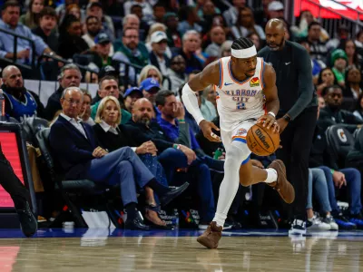 Oklahoma City Thunder guard Shai Gilgeous-Alexander (2) brings the ball down court against he Orlando Magic during the second half of an NBA basketball game Tuesday, March 17, 2026, in Orlando, Fla. (AP Photo/Kevin Kolczynski)