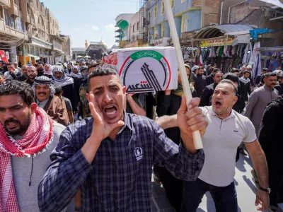 Iraqis attend the funeral of an Iranian-backed Popular Mobilization Forces fighter killed in recent airstrikes on Qaim, Tuesday, March 17, 2026. in Najaf, Iraq. (AP Photo/Anmar Khalil)