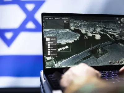Mossad agent using laptop device, operating anti ballistic system designed to counter missiles threatening country. Close up shot of Israeli counterintelligence officer defending against rockets / Foto: Dragos Condrea